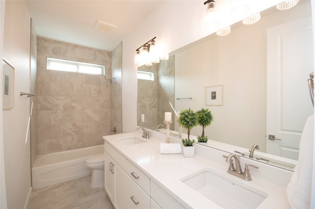 full bathroom featuring tiled shower / bath, tile floors, toilet, and dual bowl vanity