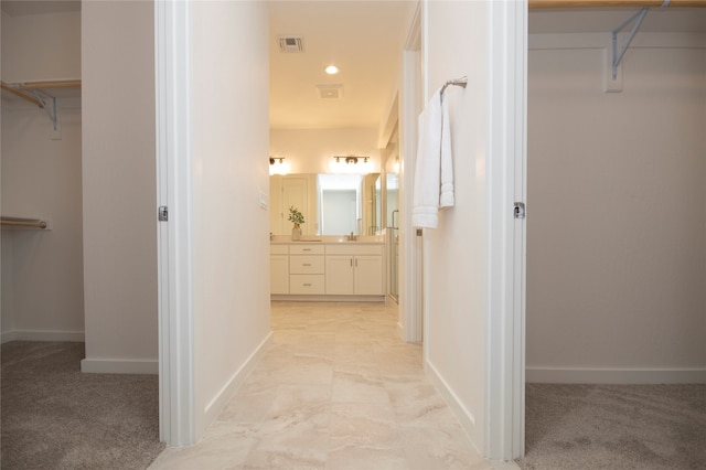 hallway with light carpet