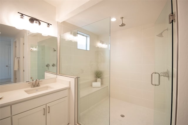 bathroom with vanity and an enclosed shower