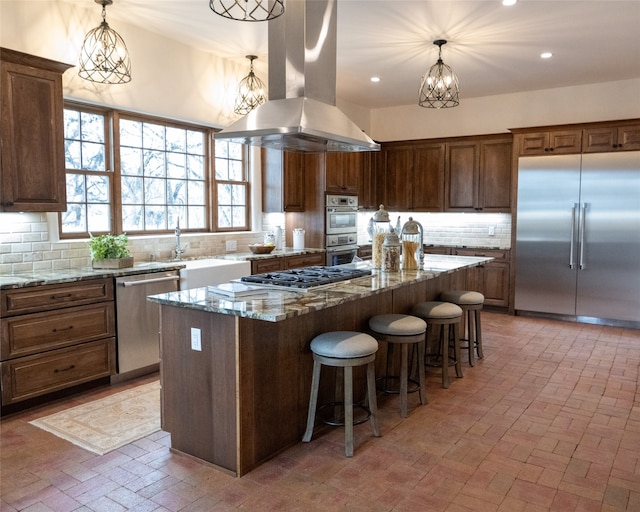 kitchen with island range hood, a kitchen island, tasteful backsplash, and stainless steel appliances