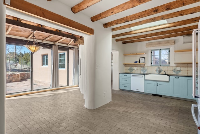 kitchen with backsplash, sink, white dishwasher, hanging light fixtures, and beamed ceiling