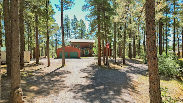 view of front of property with an outdoor structure and a garage