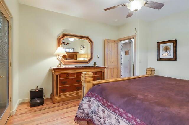 bedroom with ensuite bath, ceiling fan, and light hardwood / wood-style flooring