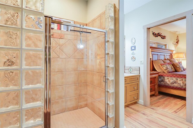 bathroom with oversized vanity and hardwood / wood-style flooring