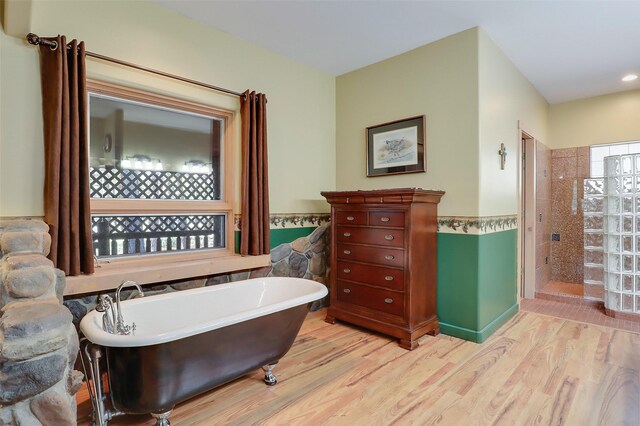 bedroom with wood ceiling, beam ceiling, light hardwood / wood-style floors, and ceiling fan