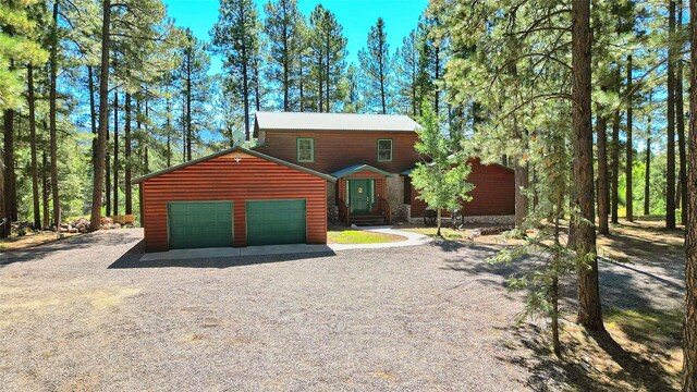 812 Timberidge Rd, Chama, NM 87520 - rustic home featuring gravel driveway and a garage