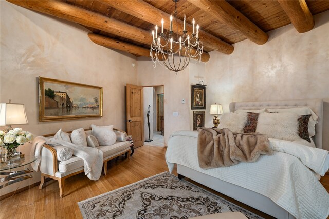 bedroom with wood ceiling, a notable chandelier, beam ceiling, and light wood-type flooring