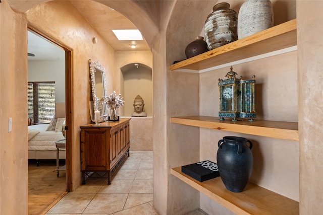 hallway with light tile patterned flooring