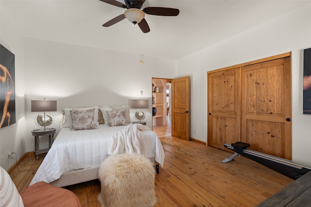 bedroom with ceiling fan and light hardwood / wood-style floors