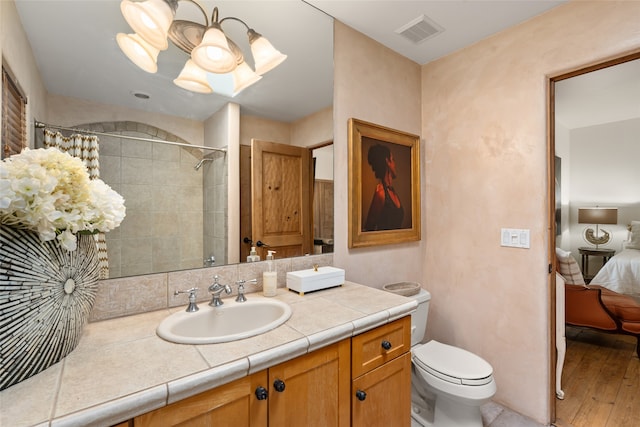 bathroom with vanity, wood-type flooring, toilet, and a shower with shower curtain