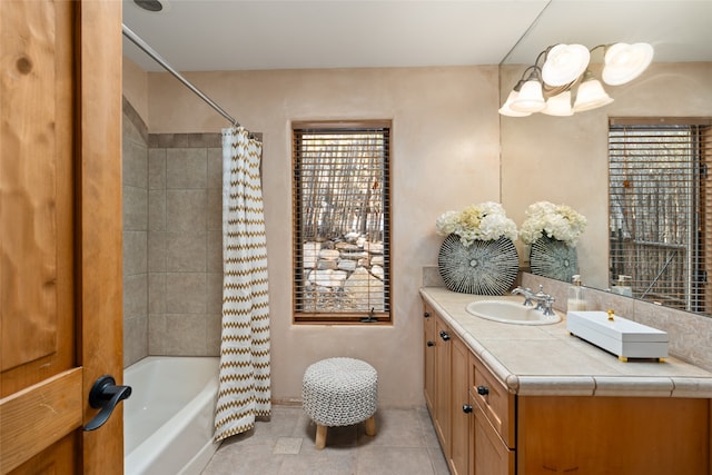 bathroom with tile patterned flooring, vanity, and shower / bath combination with curtain