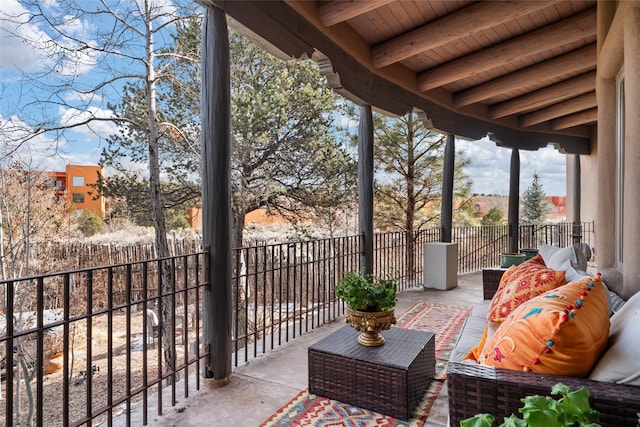 balcony with outdoor lounge area and a patio area