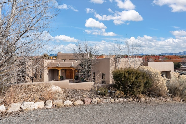 southwest-style home featuring a mountain view