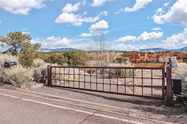 view of gate with a mountain view