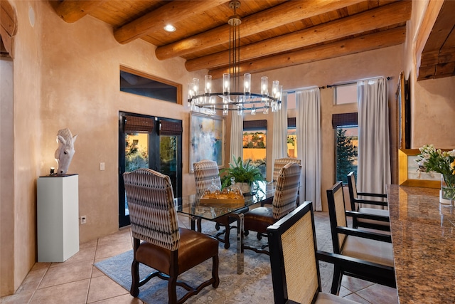 tiled dining area featuring an inviting chandelier, wood ceiling, and beam ceiling