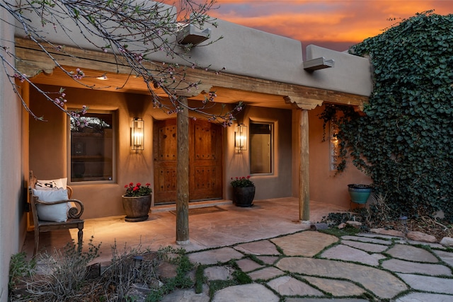 view of patio terrace at dusk