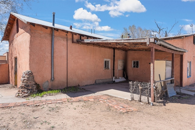 back of property with a patio area