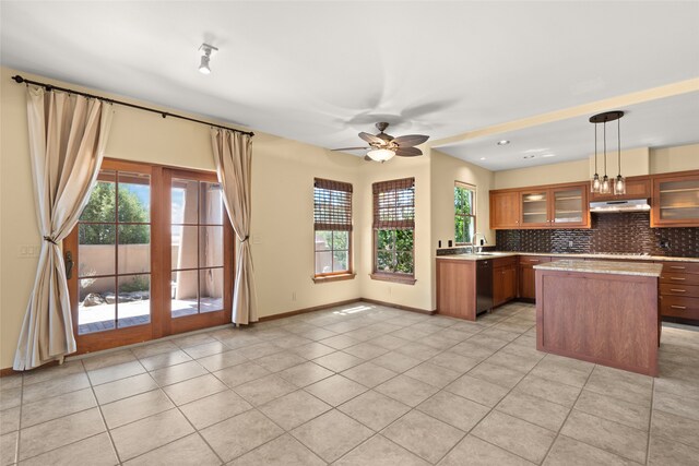 kitchen featuring ceiling fan, decorative light fixtures, light tile patterned floors, and black appliances