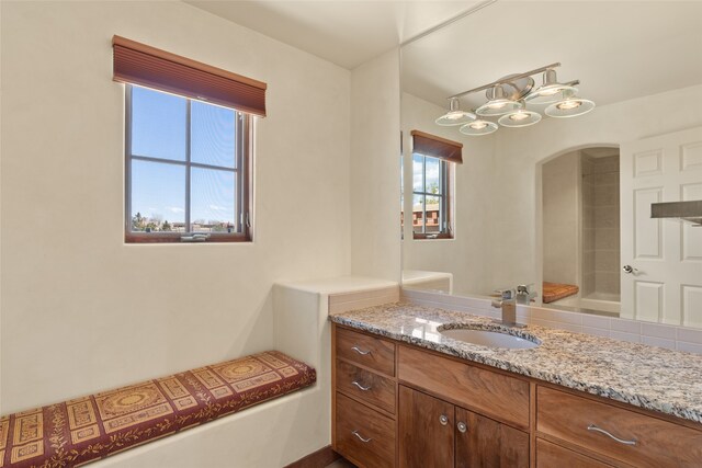 bathroom featuring a healthy amount of sunlight and vanity