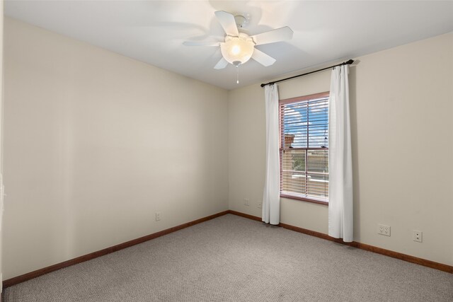 carpeted empty room with ceiling fan