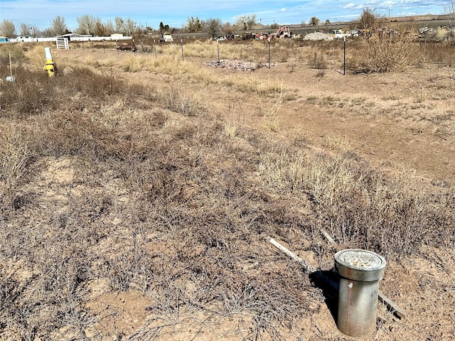 view of yard with a rural view