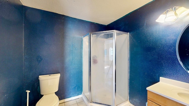 bathroom featuring a shower with door, toilet, tile flooring, and vanity