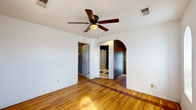 spare room with ceiling fan and hardwood / wood-style flooring