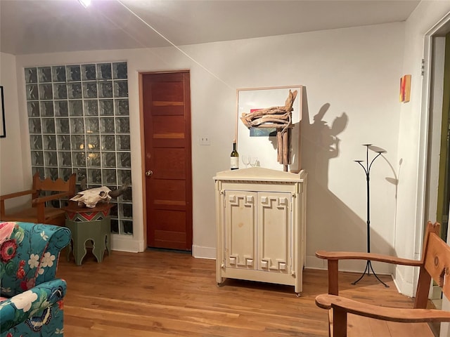 sitting room with light hardwood / wood-style floors