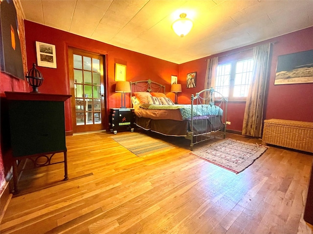 bedroom with hardwood / wood-style floors