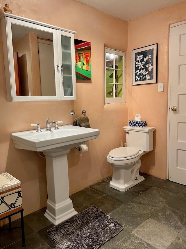 bathroom featuring toilet