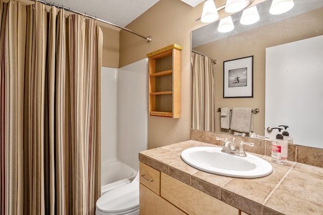 full bathroom featuring a textured ceiling, shower / bath combination with curtain, vanity, and toilet