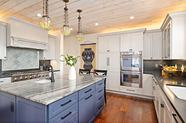 kitchen with wooden ceiling, white cabinetry, and stainless steel appliances