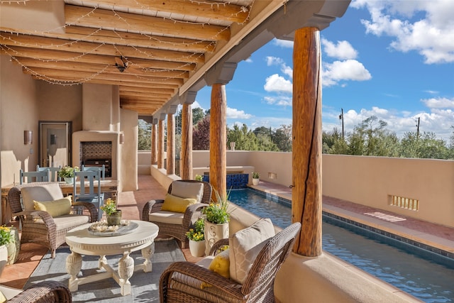 view of patio / terrace with a fenced in pool and an outdoor hangout area