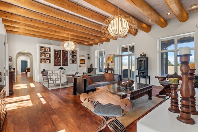 living room with wood ceiling, dark hardwood / wood-style flooring, and beamed ceiling