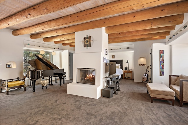 sitting room with carpet floors, beamed ceiling, and wooden ceiling