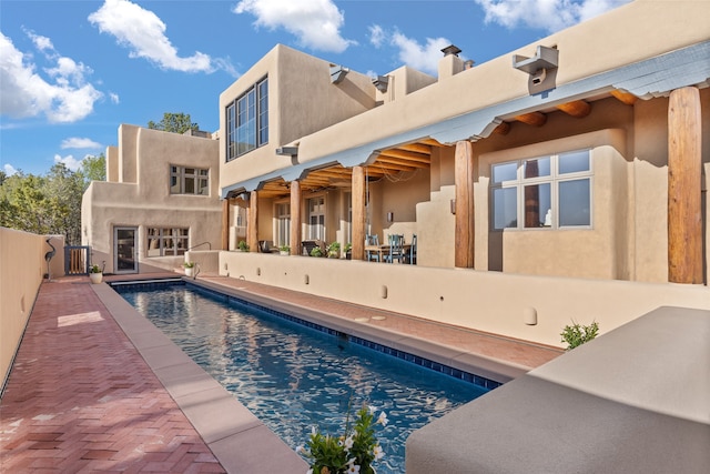 view of swimming pool featuring a patio