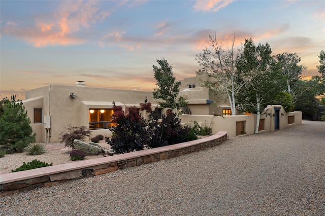 view of property exterior at dusk