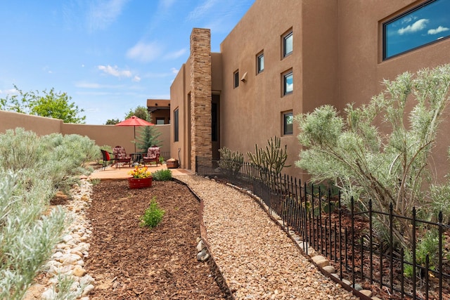 view of yard with fence and a patio area