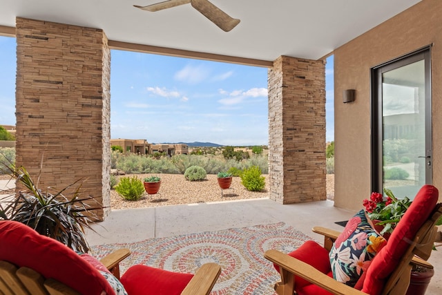 view of patio featuring ceiling fan