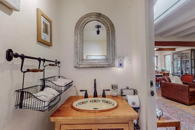 interior space with beam ceiling and sink