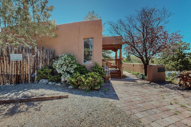 view of side of home featuring a patio