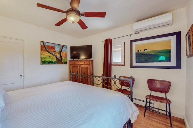 bedroom with hardwood / wood-style floors, ceiling fan, and an AC wall unit