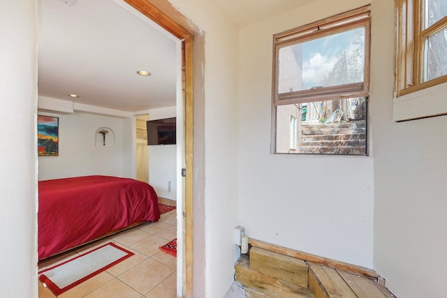 bedroom with light tile flooring