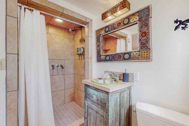 bathroom with walk in shower, vanity, and toilet