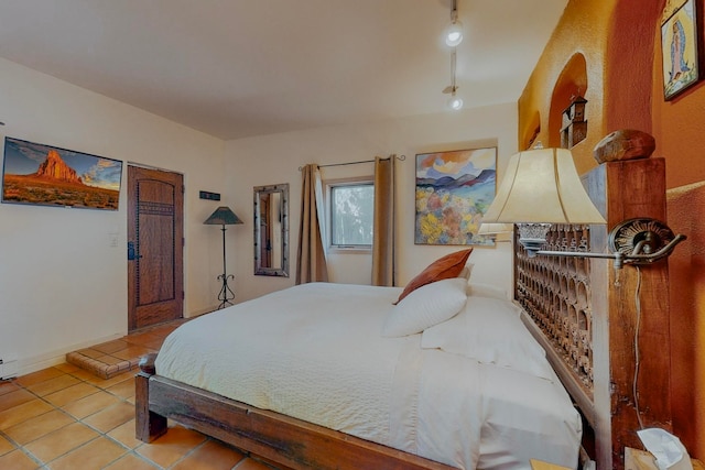 bedroom with light tile flooring