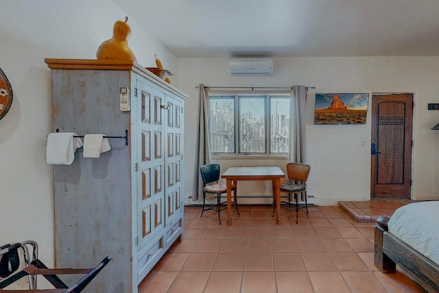 bedroom with a wall mounted AC and tile floors