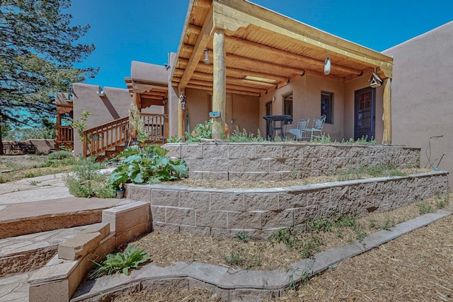 back of house with a patio area