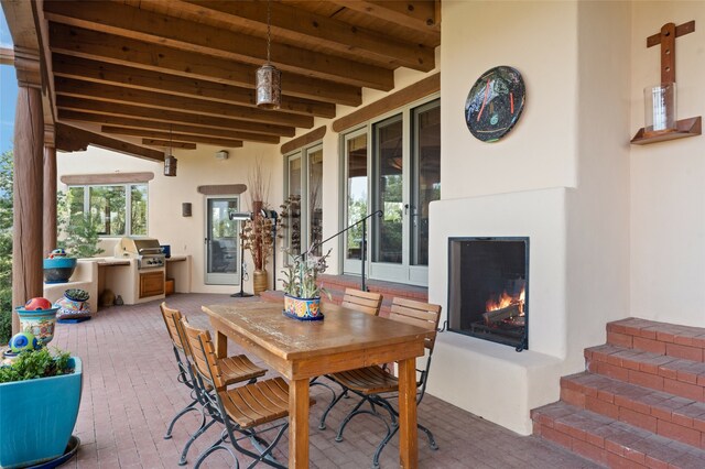 view of patio / terrace featuring a grill and exterior kitchen