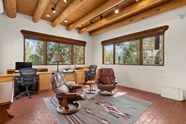 office space featuring wooden ceiling, a healthy amount of sunlight, baseboard heating, and beamed ceiling