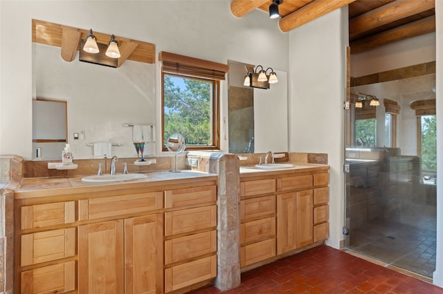 bathroom with vanity, beamed ceiling, and a shower with shower door